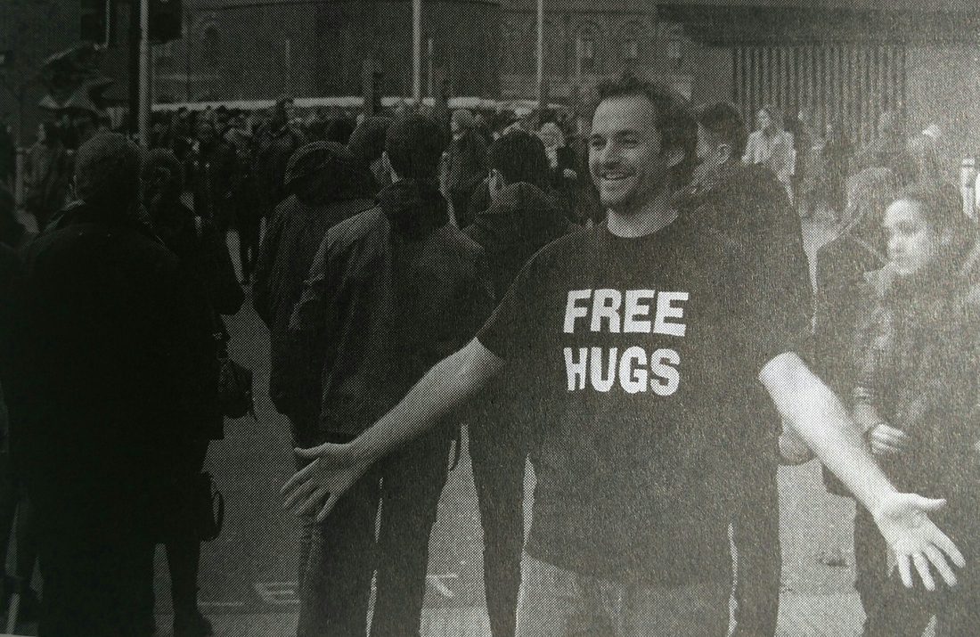 Tanner offering free hugs in London.